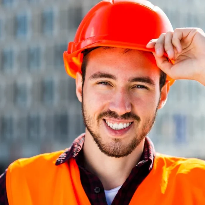 close-up-portrait-smiling-construction-engineer_23-2148233726